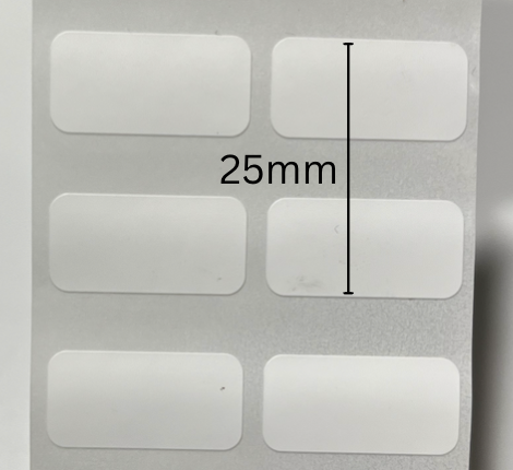 Original label-stock photo marking the 25mm print range from the top of one row to the bottom of the next